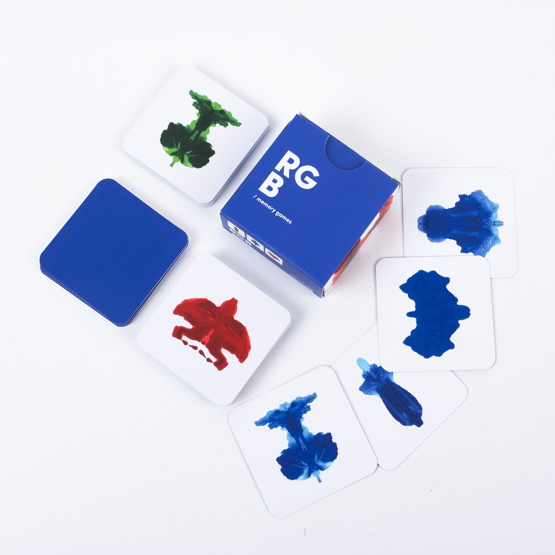 RGB Abstract memory game. Color swatch cards with blue, red, and green ink samples on a white background
